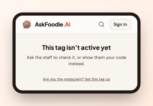 The AskFoodie page a tap on an unlinked card opens, headed "This tag isn't active yet", with the "Are you the restaurant? Set this tag up" link beneath it.